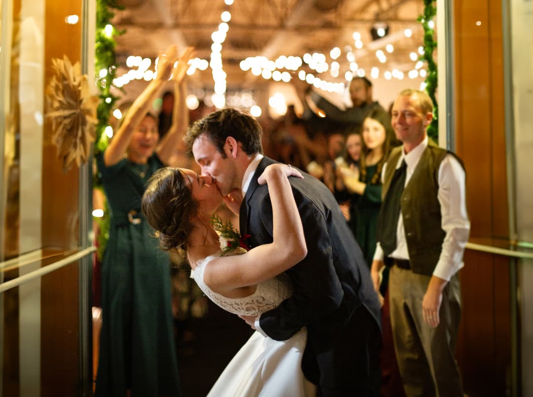 a bride and groom kissing
